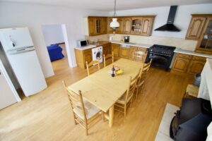 Aerial view of kitchen, dining and door through to lounge