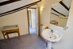 Changing table in Farmhouse bathroom