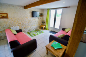 TV and lounge area at Grange Cottage